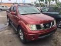 Nissan Frontier LE Crew Cab Red Brawn photo #1