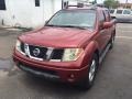 Nissan Frontier LE Crew Cab Red Brawn photo #2