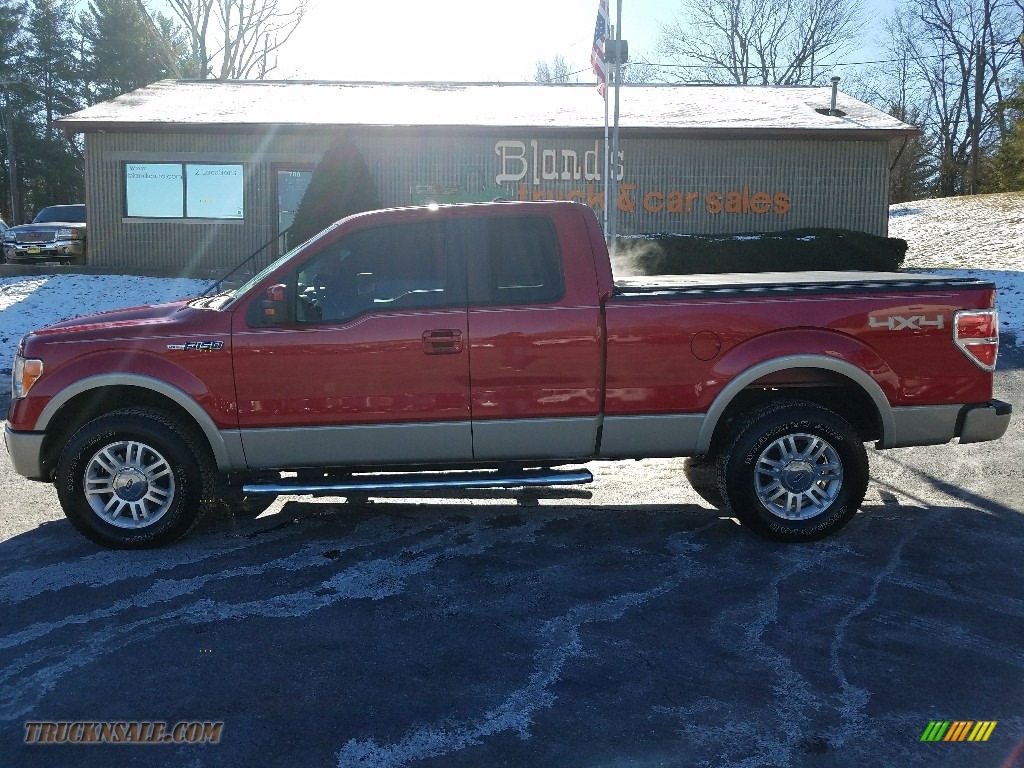 Red Candy Metallic / Black Ford F150 Lariat SuperCab 4x4